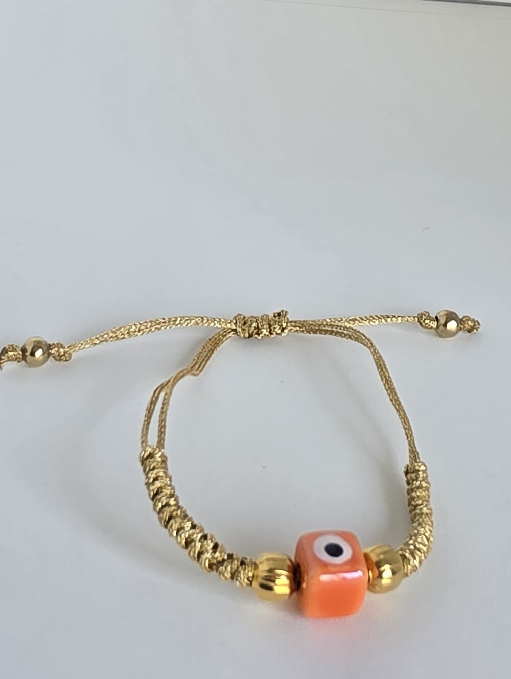 Gold-Tone Adjustable Bracelet with Orange Evil Eye Bead